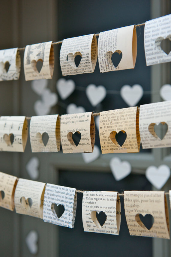 Punch heart shapes through old book pages