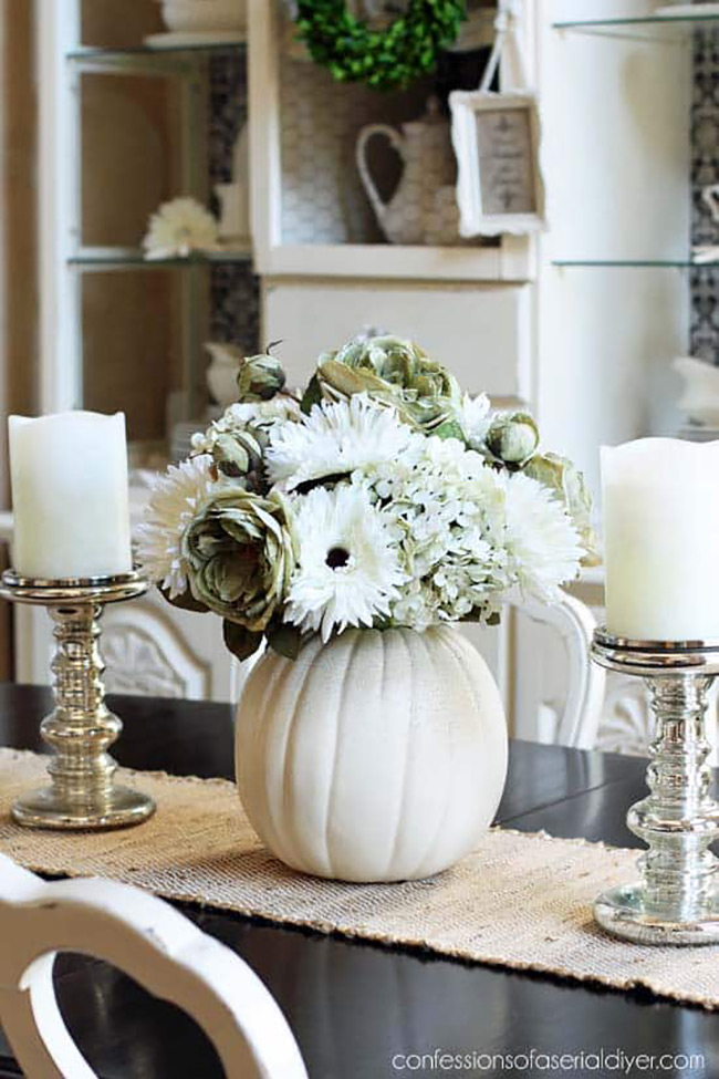 Who knew a white pumpkin could make such a stunning vase? Hollowing one out and filling it with beautiful white and soft green flowers is a brilliant idea for a unique floral arrangement that will impress any guest.