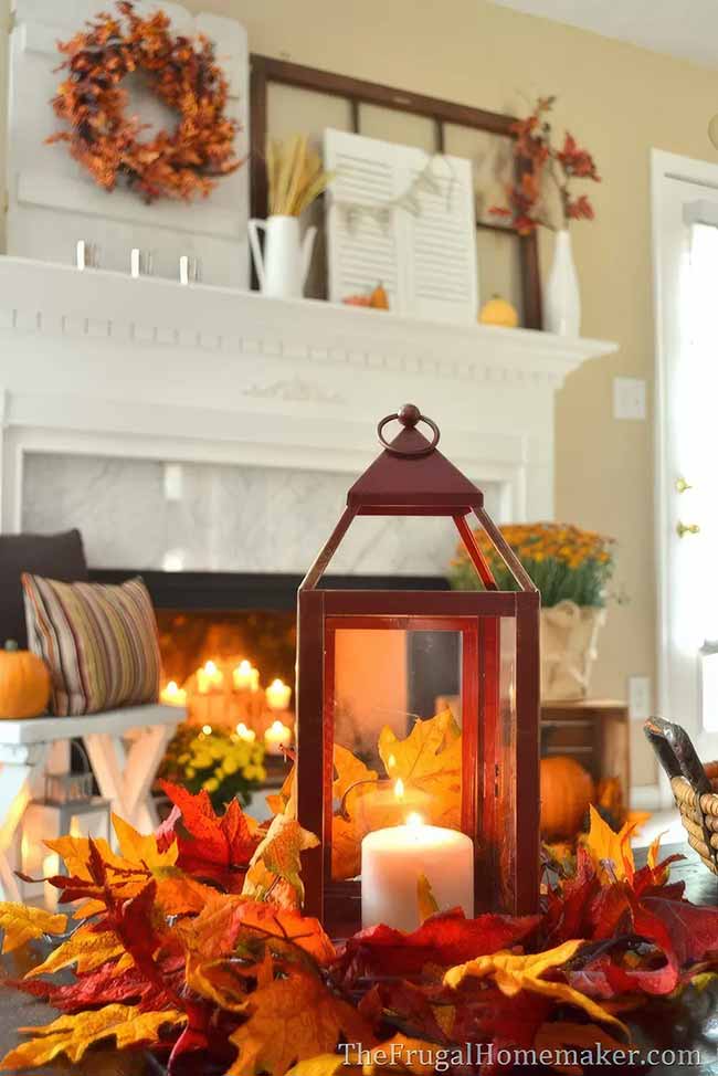This red lantern sitting on a bed of bright red and orange fall leaves really pops against the white candle inside. It brings a lot of warmth and autumn color right into the middle of the room.