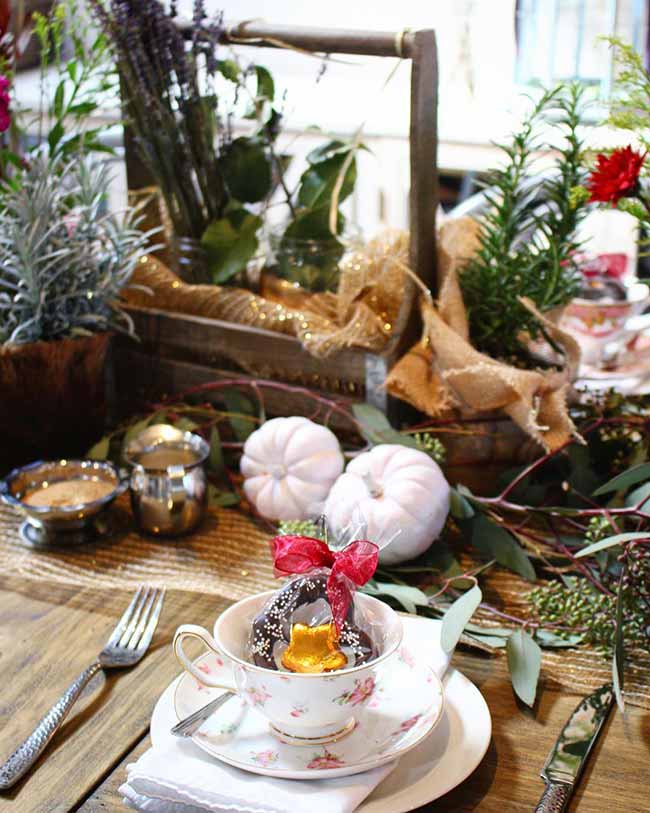 Who would have thought to put a donut in a fancy teacup as a party favor? This fall place setting idea is so sweet and special.