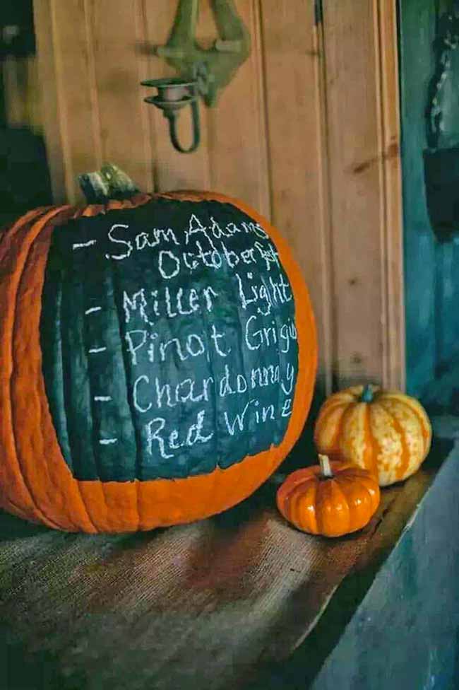 Using a pumpkin as a chalkboard menu is so clever. It's a fun and festive way to let everyone know what drinks are available at your party.