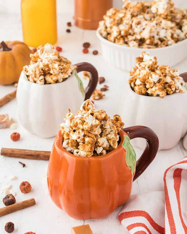 Serving caramel corn in these adorable pumpkin mugs is such a cute and festive way to hand out snacks.