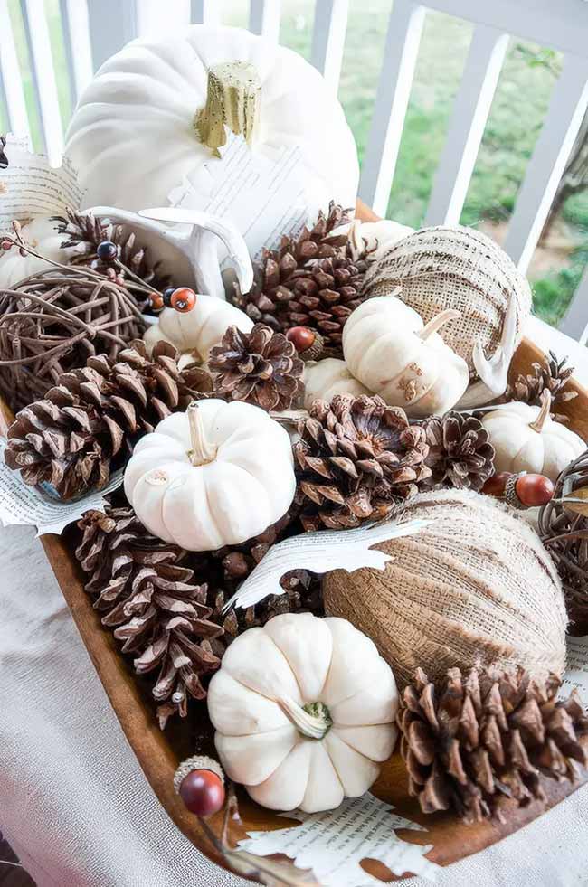 You can't go wrong with a big bowl of natural fall treasures as a centerpiece. The mix of pinecones, white pumpkins, and burlap looks so rustic and cozy.