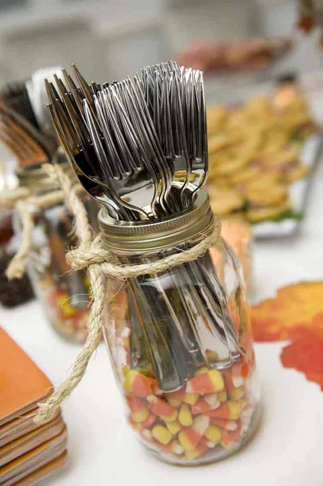 Putting forks in a mason jar filled with candy corn is a super cute idea for a buffet table.