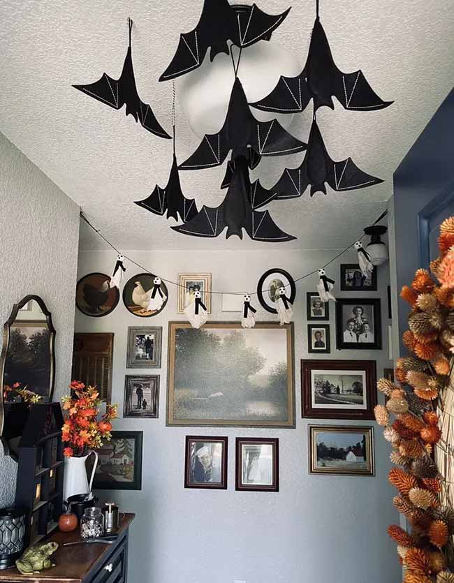 Those bats with the white stitching are really cute. Hanging them from the ceiling light, along with the little ghost garland, is a very fun and crafty Halloween decoration.