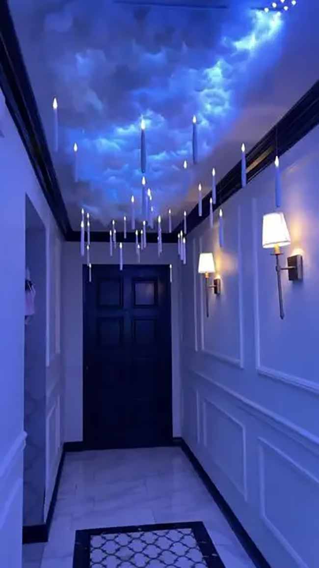 Wow, this is the best Harry Potter ceiling ever! They made the ceiling look like a blue, cloudy sky and added floating candles. It looks so real.