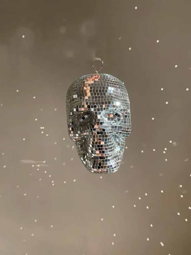 A disco ball skull is the best idea for a Halloween party! You can hang this from the ceiling for a spooky and fun vibe.