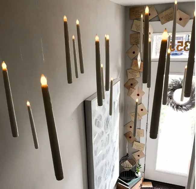 This is the perfect way to welcome people to a Harry Potter party. The floating candles from the ceiling and all the letters around the door look so magical.