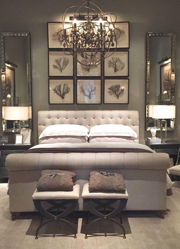 This elegant master bedroom uses two small, comfy X-base stools at the foot of the bed to provide an easy place to sit and relax.