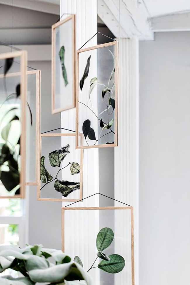 Hanging Botanical Art. Instead of regular pictures, these hanging glass frames with single leaves look fresh and airy. They move gently and let a lot of light come through the room.