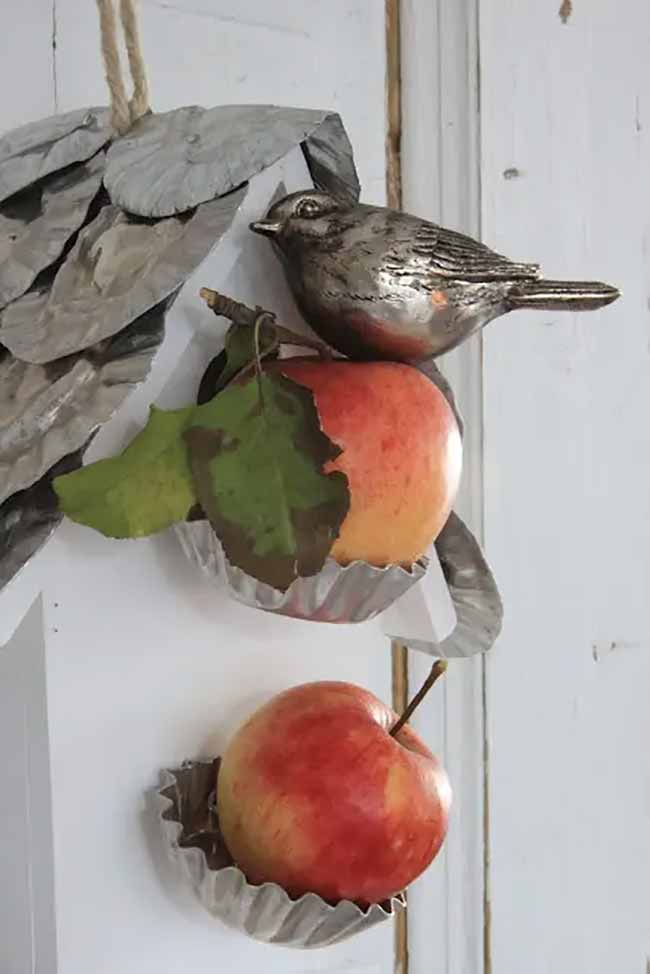 Apple and Bird Art. I really like this simple metal decoration that holds real apples in little tart cups. The silver bird sitting on top is a cute, tiny detail for a fall kitchen.