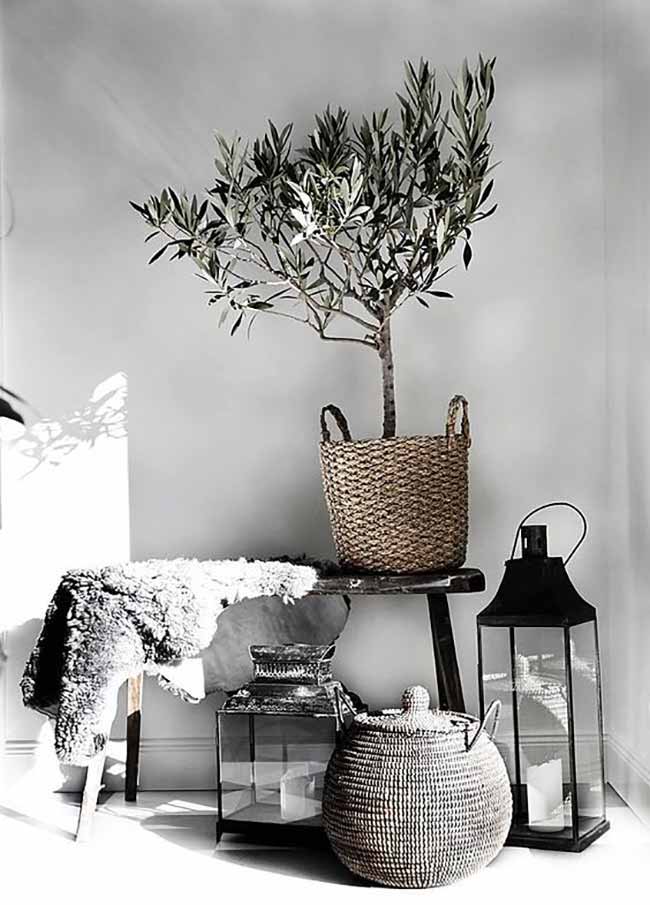 Corner of Textures. This little corner uses so many nice textures, like the woven baskets and the sheepskin rug. The tall black lantern and the olive tree make the space feel very grounded and peaceful.