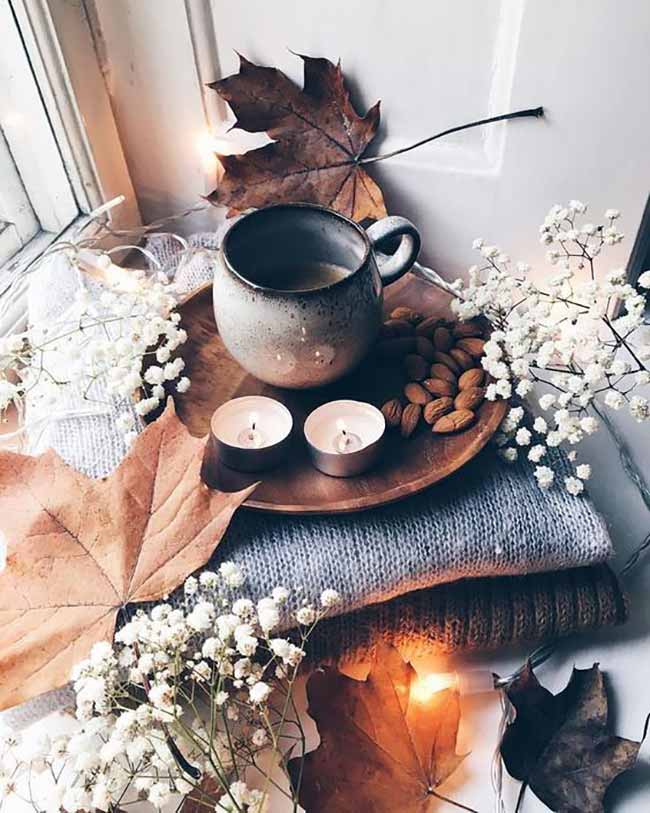 Cozy Window Scene. This looks like the perfect spot for a cozy autumn morning with a warm mug of coffee and a sweater. The bright maple leaves and little fairy lights make the whole window area feel extra warm. This simple tray holds everything you need for a quiet moment.