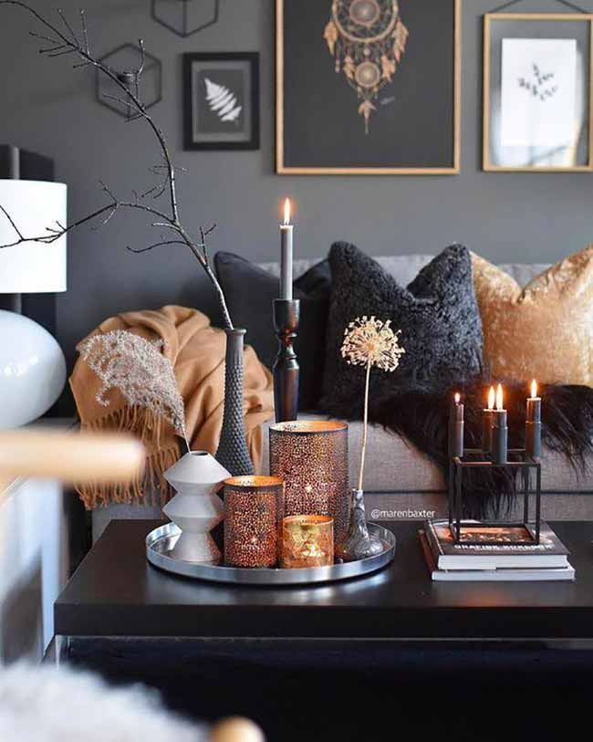 Moody Candle Tray. The dark walls and furniture make the copper and gold candle holders really stand out with their bright, glowing light.