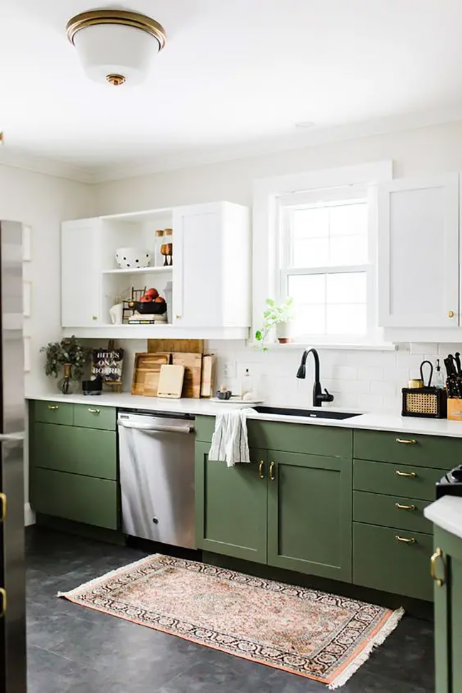 Removing the doors from the upper white cabinets makes the kitchen feel lighter and more spacious. The olive green bottom cabinets add a nice, grounding color to the space.