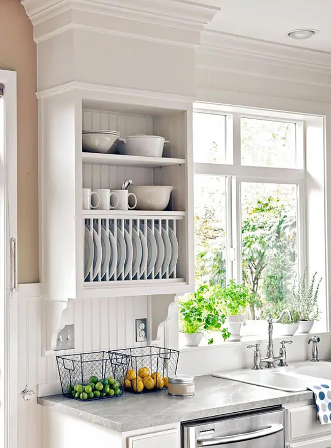 This cabinet has a special plate rack built into the bottom section. It keeps plates upright and ready to grab, while the shelves above hold bowls. This clever no door kitchen cabinet design maximizes storage in a small space.