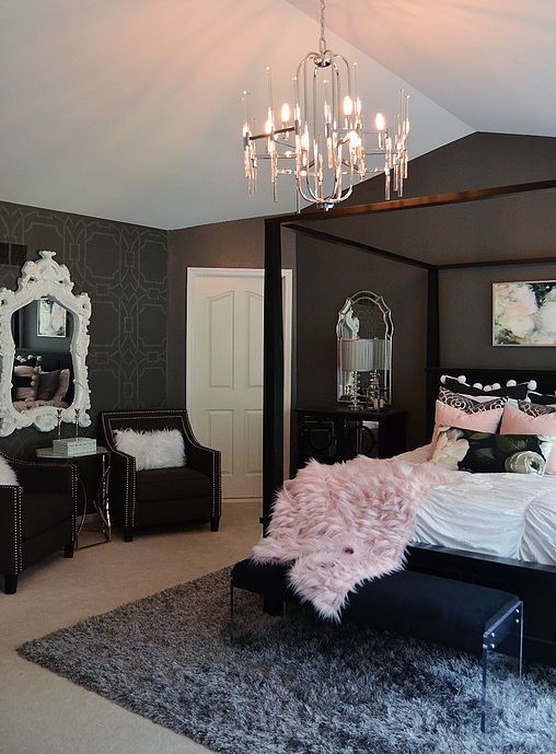 That fuzzy pink blanket looks so soft on the dark four-poster bed. This pink and black bedroom uses a fancy white mirror to brighten up the dark grey walls.